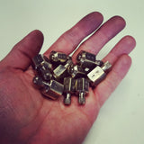 Machined brass Put and Take gambling spinning tops - Butterfield Machine