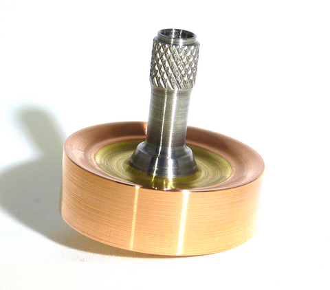 Copper, brass and stainless steel spinning top