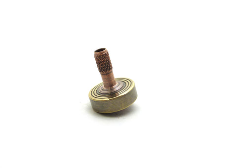 Machined brass and copper spinning top