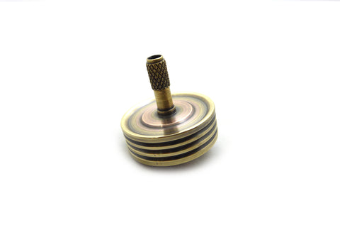 Machined brass and copper spinning top