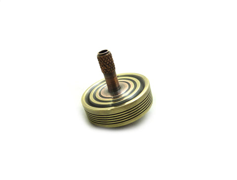 Machined brass and copper spinning top