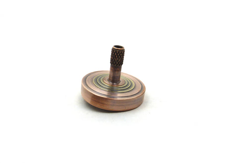 Machined brass and copper spinning top
