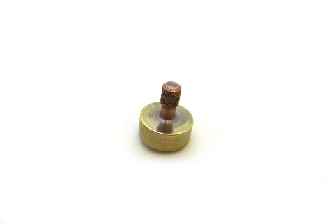 Machined copper and brass spinning top