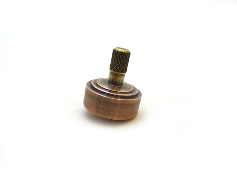 Copper and brass spinning top