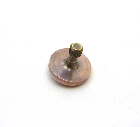 Machined copper and brass spinning top